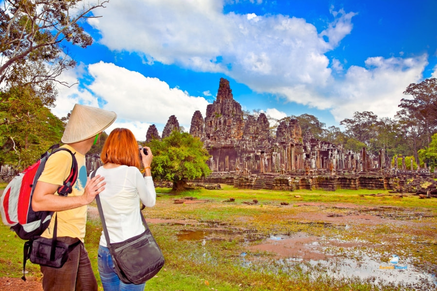 Tourists exploring ancient Angkor Thom temple Cambodia – Auasia Travel